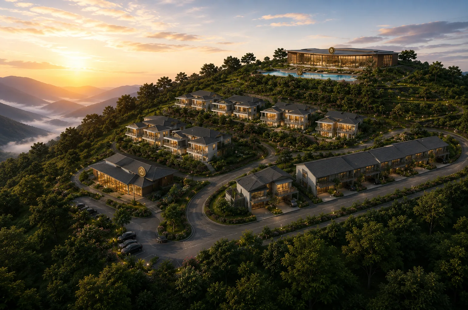 Aerial view of the hillside masterplan at sunset with terraced villas and the summit wellness centre